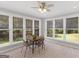 Sunroom with views of the pond and backyard from multiple windows at 114 Overlook Dr, Mcdonough, GA 30252