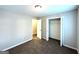 Bright bedroom featuring neutral paint, carpet, and closet space at 3170 W Point Cir, Douglasville, GA 30135