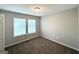 This cozy bedroom showcases two windows and neutral walls and plush carpet at 3170 W Point Cir, Douglasville, GA 30135