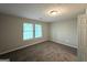 Bright bedroom with natural light, neutral walls, and plush carpet offers a serene space at 3170 W Point Cir, Douglasville, GA 30135