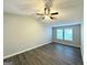 Cozy bedroom with modern ceiling fan, vinyl floors, and bright neutral paint at 3170 W Point Cir, Douglasville, GA 30135