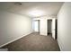 Neutral-painted bedroom featuring closet space, carpet, and an open floor plan at 3170 W Point Cir, Douglasville, GA 30135