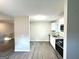 Bright kitchen with stainless steel appliances, modern finishes, and wood-look floors at 3170 W Point Cir, Douglasville, GA 30135