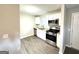 Modern kitchen features stainless steel appliances, granite countertops, and hardwood flooring at 3170 W Point Cir, Douglasville, GA 30135