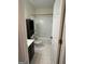 Clean bathroom with white tile, a dark vanity, and a combined tub and shower at 1031 Jordan Rd, Dacula, GA 30019