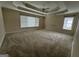 Spacious carpeted bedroom featuring two windows for natural light and a ceiling fan at 1031 Jordan Rd, Dacula, GA 30019