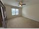 Bedroom with window, neutral carpet and built in bookcase at 1031 Jordan Rd, Dacula, GA 30019