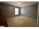 Empty bedroom with neutral walls and carpet at 1031 Jordan Rd, Dacula, GA 30019