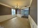 Dining room featuring a large window, wainscoting, and an elegant chandelier at 1031 Jordan Rd, Dacula, GA 30019