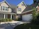 Charming two-story home with brick accents, manicured landscaping, and a spacious driveway at 1031 Jordan Rd, Dacula, GA 30019