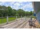 Inviting back deck overlooking the expansive backyard, lush greenery, and a refreshing pool at 108 Country Acres Ct, Mcdonough, GA 30253