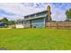Large backyard with a wooden fence and deck at 108 Country Acres Ct, Mcdonough, GA 30253