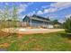 A backyard with a newly updated inground pool, a wooden fence, and a spacious grassy area at 108 Country Acres Ct, Mcdonough, GA 30253