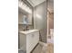 Bathroom featuring a white vanity with double sinks, modern fixtures, and a shower at 108 Country Acres Ct, Mcdonough, GA 30253