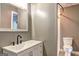 Bathroom with a white vanity and a modern black faucet next to a toilet at 108 Country Acres Ct, Mcdonough, GA 30253