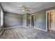 Spacious bedroom featuring plush carpeting, ceiling fan, and neutral paint scheme at 108 Country Acres Ct, Mcdonough, GA 30253