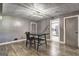 Dining room featuring hard wood flooring and modern lighting fixture at 108 Country Acres Ct, Mcdonough, GA 30253