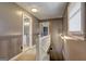 Upstairs hallway with natural light leading to a bathroom and bedrooms at 108 Country Acres Ct, Mcdonough, GA 30253