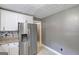 Kitchen with stainless steel refrigerator and white cabinets with granite countertops at 108 Country Acres Ct, Mcdonough, GA 30253