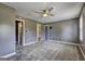 Spacious main bedroom with carpeted floors, ensuite bathroom and two closets at 108 Country Acres Ct, Mcdonough, GA 30253