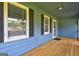 Charming covered porch with wood decking at 108 Country Acres Ct, Mcdonough, GA 30253