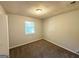 This bedroom features neutral walls, carpet, and a window providing natural light at 4039 Codel Nw St, Atlanta, GA 30331