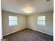 Sunlit bedroom featuring plush carpeting, neutral walls, and bright windows with blinds at 4039 Codel Nw St, Atlanta, GA 30331