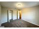Carpeted bedroom with a bright window, neutral walls, and a closet with sliding doors at 4039 Codel Nw St, Atlanta, GA 30331