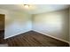 Bright, vacant bedroom with sleek, wood-look floors and neutral walls at 4039 Codel Nw St, Atlanta, GA 30331
