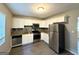 Modern kitchen with stainless steel appliances, granite countertops, and decorative backsplash at 4039 Codel Nw St, Atlanta, GA 30331