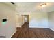 Spacious living room with wood-look floors, neutral walls, and modern climate control system at 4039 Codel Nw St, Atlanta, GA 30331