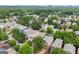 Aerial view of a neighborhood featuring houses surrounded by trees and well-maintained lawns at 1104 Victoria Ne St, Atlanta, GA 30319