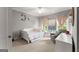 Cozy bedroom featuring a daybed, comfortable chair, and decorative accents, creating a warm and inviting atmosphere at 1104 Victoria Ne St, Atlanta, GA 30319