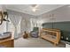 Charming Bedroom featuring a crib, rocking chair, and soft decor, creating a cozy and inviting space at 1104 Victoria Ne St, Atlanta, GA 30319