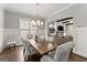 Bright dining room featuring a rustic wooden table, stylish chairs, and modern lighting at 1104 Victoria Ne St, Atlanta, GA 30319