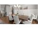 Elegant dining room with a large wooden table, comfortable upholstered chairs and stylish chandelier at 1104 Victoria Ne St, Atlanta, GA 30319