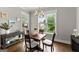 Inviting dining area featuring natural light, stylish decor, and a table perfect for Gathering meals at 1104 Victoria Ne St, Atlanta, GA 30319
