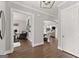 Spacious hallway with hardwood floors, neutral paint, and arched doorway to the main rooms at 1104 Victoria Ne St, Atlanta, GA 30319