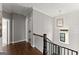 Upstairs hallway with natural light, leading to bedrooms and bathrooms at 1104 Victoria Ne St, Atlanta, GA 30319