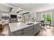 Well-appointed kitchen with quartz countertops and island, seamlessly connected to a cozy living area with a fireplace at 1104 Victoria Ne St, Atlanta, GA 30319