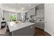 Bright kitchen with stainless steel appliances, ample counter space, a central island, and sleek gray cabinetry at 1104 Victoria Ne St, Atlanta, GA 30319