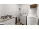 Functional laundry room featuring modern appliances, a sink, and storage options at 1104 Victoria Ne St, Atlanta, GA 30319