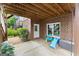 Back patio with a wooden ceiling and brick wall, offering a shaded outdoor retreat at 1104 Victoria Ne St, Atlanta, GA 30319