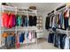 Spacious walk-in closet with custom shelving, hanging rods, and ample storage for clothes and accessories at 1104 Victoria Ne St, Atlanta, GA 30319