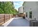 A spacious fenced backyard with a brick grill and outdoor seating area at 158 Bryon Ln, Acworth, GA 30102