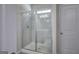 Tiled bathroom with a glass-enclosed shower and a built-in bench at 158 Bryon Ln, Acworth, GA 30102