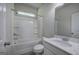 Bathroom with combination tub and shower, white vanity and marble countertop at 158 Bryon Ln, Acworth, GA 30102