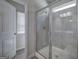 Bathroom featuring a tiled shower with glass door and a white door leading to another room at 158 Bryon Ln, Acworth, GA 30102