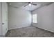 A clean and well-lit bedroom featuring neutral carpeting and a ceiling fan at 158 Bryon Ln, Acworth, GA 30102