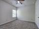 Bedroom featuring neutral carpet, ceiling fan, and a window letting in natural light at 158 Bryon Ln, Acworth, GA 30102